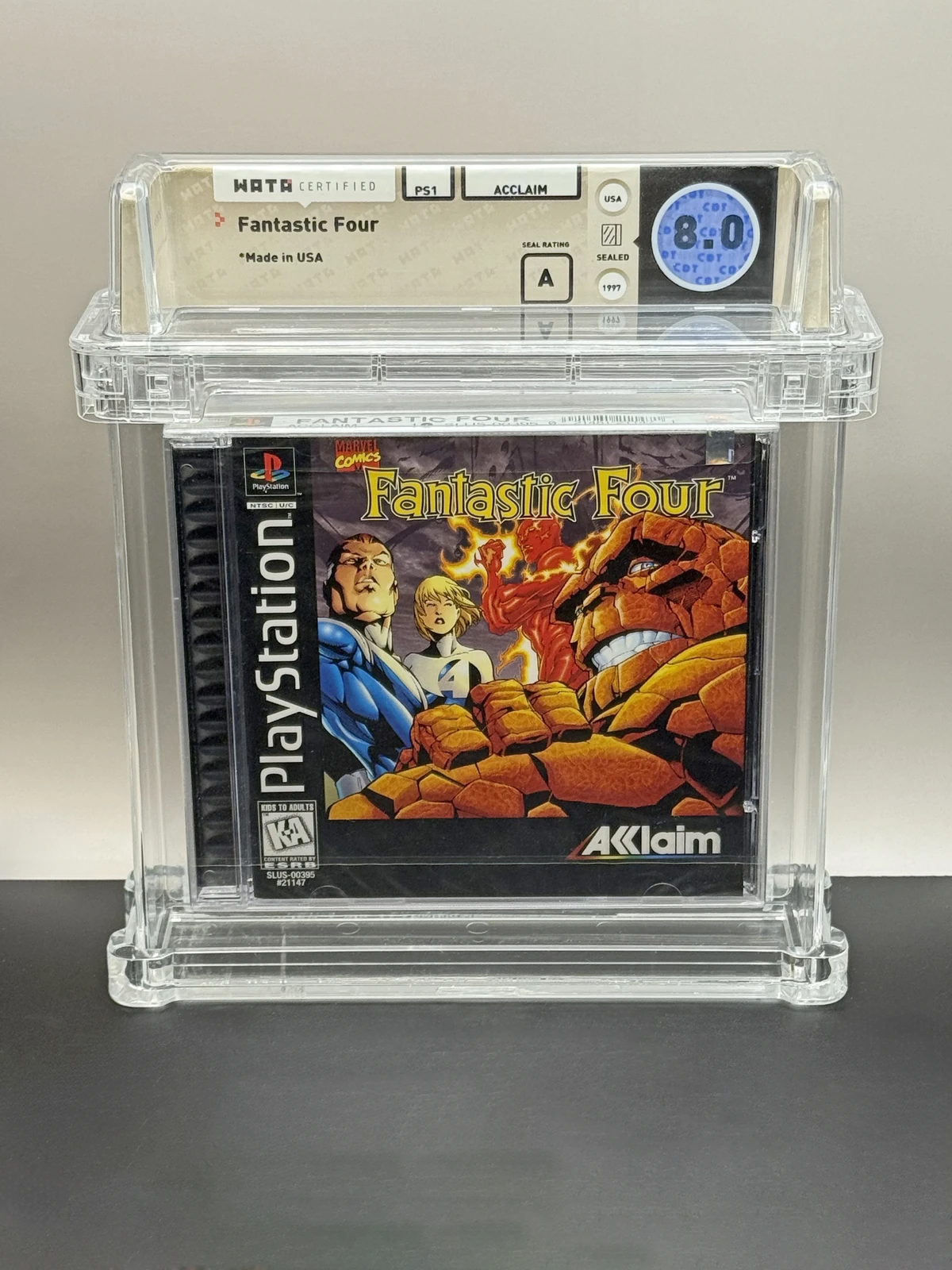 Front of Fantastic Four for PlayStation, with Wata 8.0 and A seal label